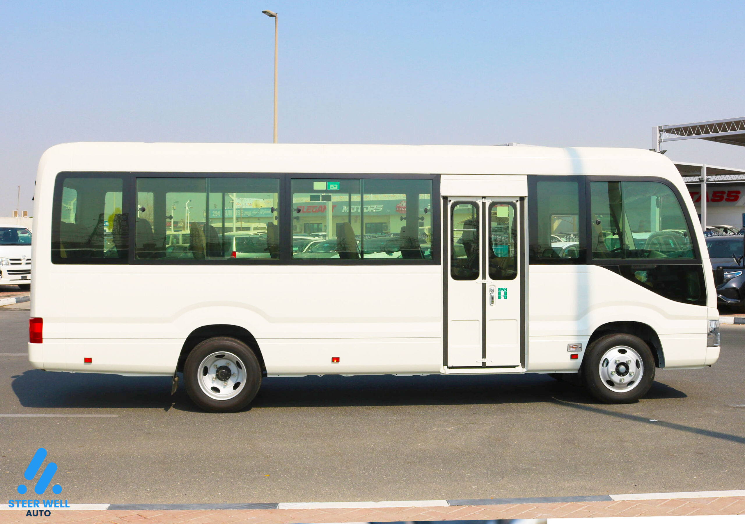 Toyota Coaster 2024 23 Seater  – White